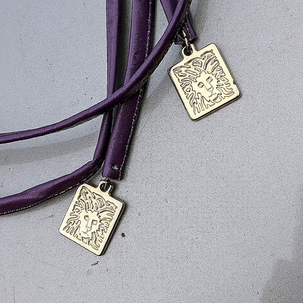 Anne Klein leather belt.  Vintage. Approx 58".  Soft purple. Goldtone lions.